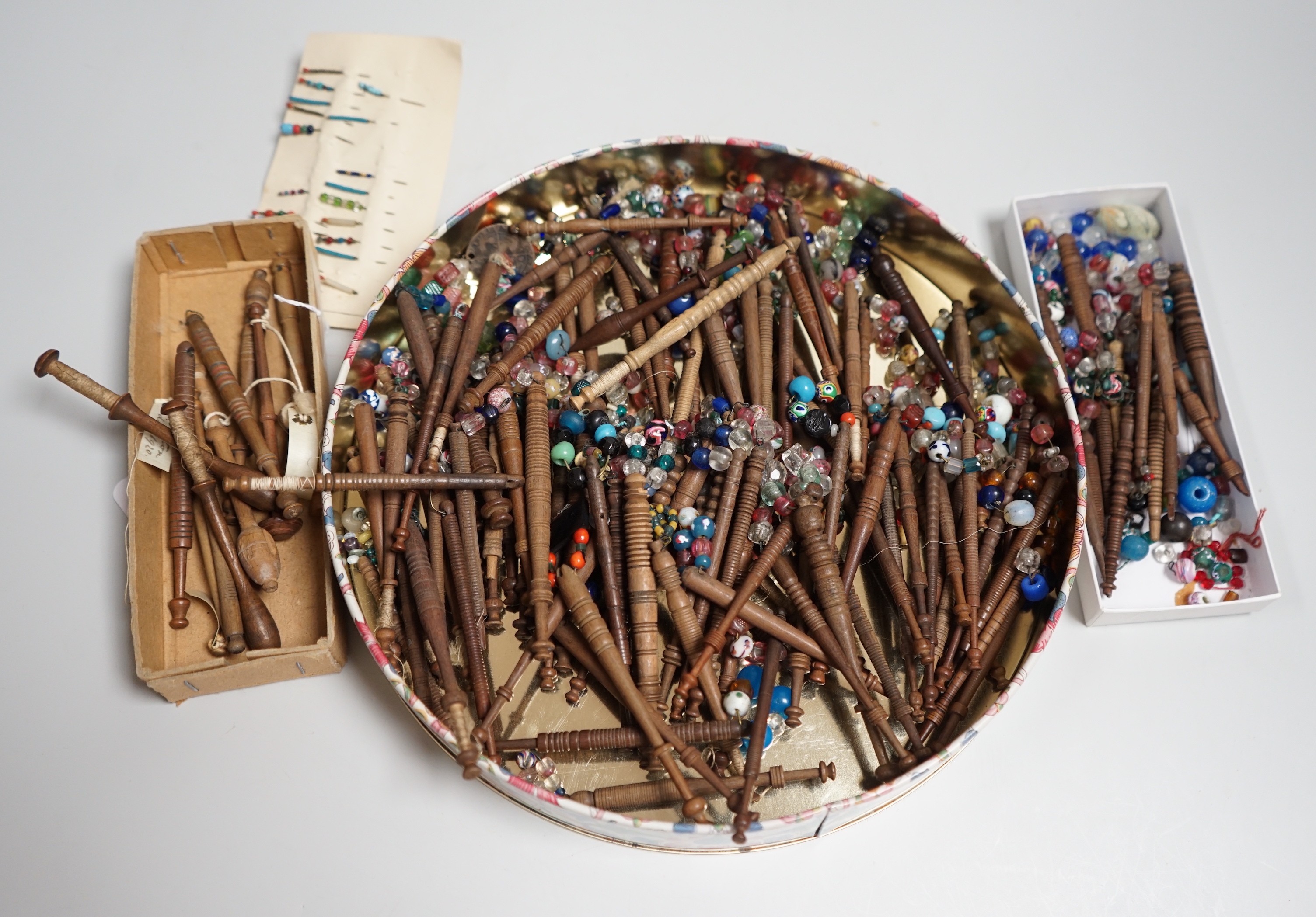 One hundred 19th century turned lace bobbins, plus various broken bobbins and spare beading